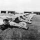A lineup of Albatros D.III fighters of Jagdstaffel 50 - mid to late 1917. The subdued staffel scheme of black and white stripes and chevrons can be seen on the fuselage of most German figher planes, which are otherwise in factory finish.