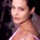 Originally, Angelina had a dragon on her left upper arm. Then she added, "Billie Bob" for her second husband. Both have since been covered.