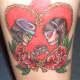 skull tattoos and flowers