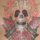 skull tattoos and flowers