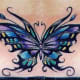 This butterfly tattoo seems to be inspired by stained-glass art.
