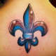 Blue and copper fleur-de-lis tattoo