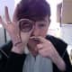 An interesting take is to tattoo a mustache on one finger and a monocle on the other.