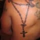 Rosary and dove tattoo