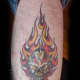 A flaming skull tattoo.
