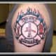 This firefighter's tattoo features blue flames.