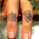 Very ornate thumb tattoos. Wonder how these will stand the test of time.