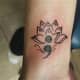 Lotus and semicolon tattoo