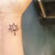 Lotus semicolon tattoo