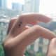 Tiny semicolon tattoo on finger