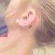 Semicolon tattoo behind the ear