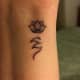 Highly stylized semicolon tattoo