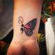 Butterfly semicolon tattoo
