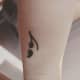 Semicolon and musical note tattoo