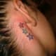 stars tattooed behind someone's ears
