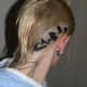 birds behind a person's ear
