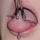 Close-up of a horizontal tongue piercing