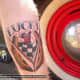 A "Lucky 7" tattoo with a horseshoe.