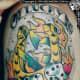 Another multi-symbol tattoo, this one features the horseshoe, dice, clover, card suits, and the number 13.