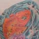 Here is Crystal's finished koi tattoo, now with all of the colors and shading done.