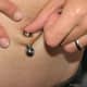 Inverse navel piercing stretched to a 0-gauge