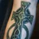 A green cross. (by Matt Ellis, Way Cool Tattoo Uptown, 5203 yonge street, Toronto, Ontario, Canada)