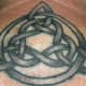 A looser black knot. (by Big Mike, Rubes Tattoo, Arcadia, California, USA)