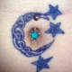 A moon-shaped knot around a bellybutton piercing. (Devil Bitch, Barnsley, UK