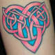 A vibrant pink and blue knot. (by Josh Howard, Deluxe Tattoo, 1459 W. Irving Prk. Chicago, Illinois)