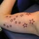 The constellation Taurus tattooed in stars.