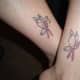 Butterfly-pink ribbon tattoos.