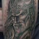 A Norse mythology-inspired warrior tattoo.