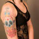 Old school calavera with roses, daggers, and spider webs.