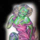 A green zombie-like pinup girl tattoo.
