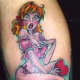 A pinup girl holding a heart.