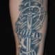 A sword tattoo with text.