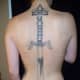 A large sword tattoo on the back.