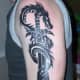 Another sword-and-dragon tattoo.