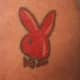 A pink Playboy bunny tattoo designed to look shiny.