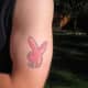 Another pink Playboy bunny tattoo, this one inked on the arm.