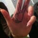 This Playboy bunny is tattooed on the wearer's fingers.