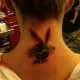 A black bunny tattooed on the back of the neck.
