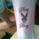 This bunny tattoo incorporates the word &quot;playboy.&quot;