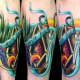Color Tattoo of a Coffin and Scissors 