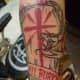 Color Tattoo of a Coffin With a Snake