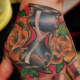 Hourglass tattoo on hand