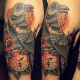 Raven, key, and clock tattoo.