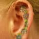 Detailed flowers down the earlobe