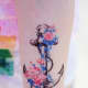 Anchor and flower tattoo