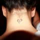 Broken heart tattoo on back of neck